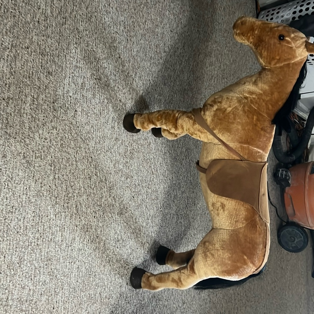A horse toy that is 24 by 32 it is a very fun and very portable toy!.